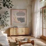 A Woman Can Conquer the World by Emily Adams. Shown in a natural wood frame in a cozy modern living room. Available as an archival giclee rolled canvas, fine art paper, or poster print. SKU 30585a.