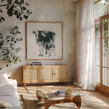 Cow and Calf by Emily Adams. Shown in a natural wood frame in a cozy modern living room. Available as an archival giclee rolled canvas, fine art paper, or poster print. SKU 23731a.