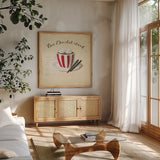 Holiday Cafe V by Emily Adams. Shown in a natural wood frame in a cozy modern living room. Available as an archival giclee rolled canvas, fine art paper, or poster print. SKU 30938a.