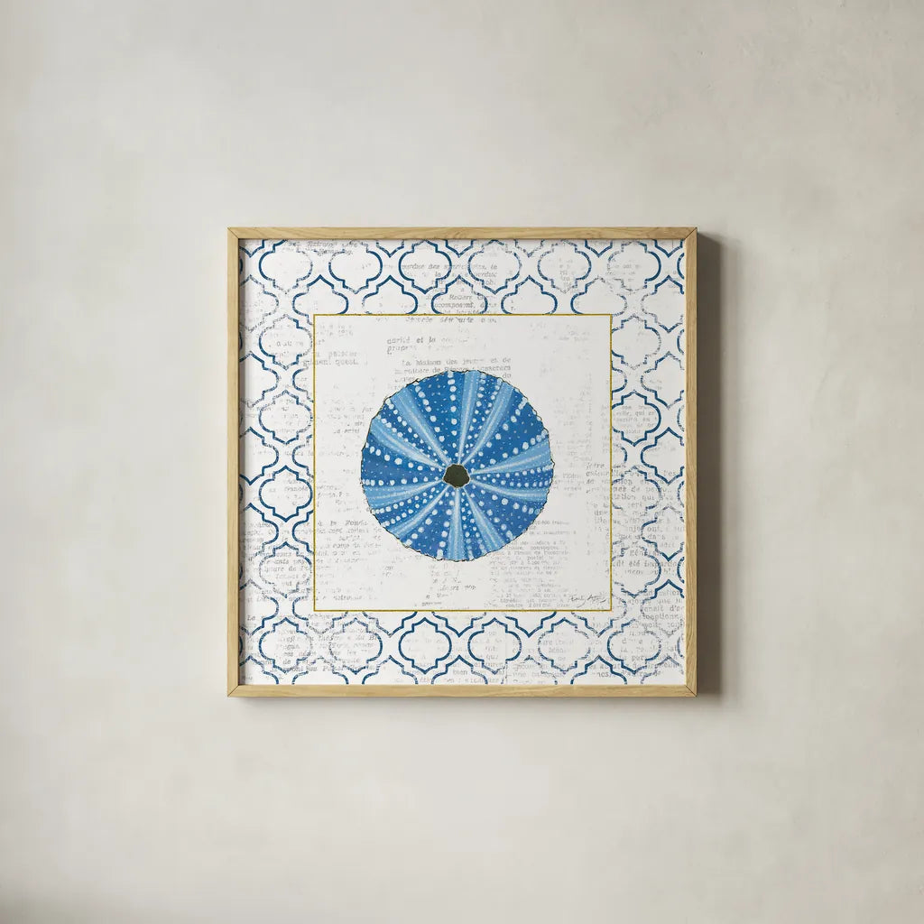 Navy Circular Shell on Newsprint with Gold by Emily Adams. Shown in a natural wood glass frame for a timeless modern aesthetic. Available as an archival giclee rolled canvas, fine art paper, or poster print. SKU 23562a.