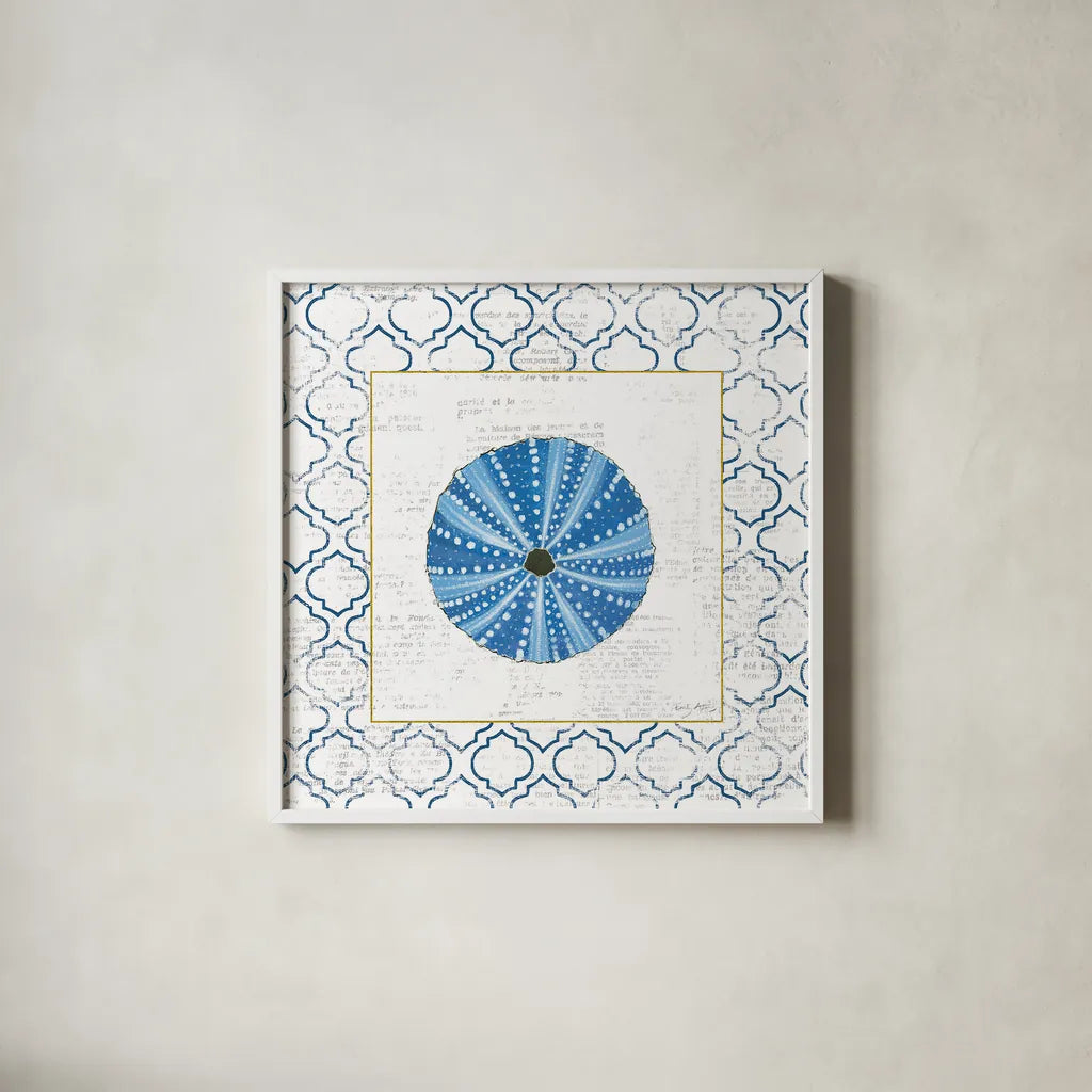 Navy Circular Shell on Newsprint with Gold by Emily Adams. Shown in a crisp white glass frame for a clean and minimalist style. Available as an archival giclee rolled canvas, fine art paper, or poster print. SKU 23562a.