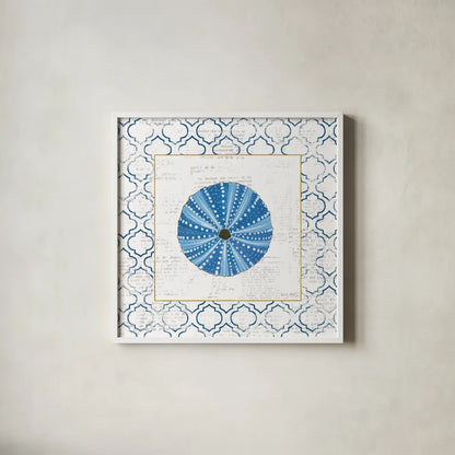 Navy Circular Shell on Newsprint with Gold by Emily Adams. Shown in a crisp white glass frame for a clean and minimalist style. Available as an archival giclee rolled canvas, fine art paper, or poster print. SKU 23562a.