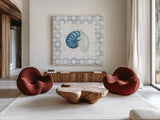 Navy Nautilus Shell on Newsprint by Emily Adams. Shown as extra-large giant wall art in a modern living room. Available as an archival giclee rolled canvas, fine art paper, or poster print. SKU 23471a.