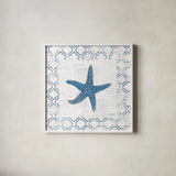 Navy Starfish on Newsprint by Emily Adams. Shown in a crisp white glass frame for a clean and minimalist style. Available as an archival giclee rolled canvas, fine art paper, or poster print. SKU 23473a.