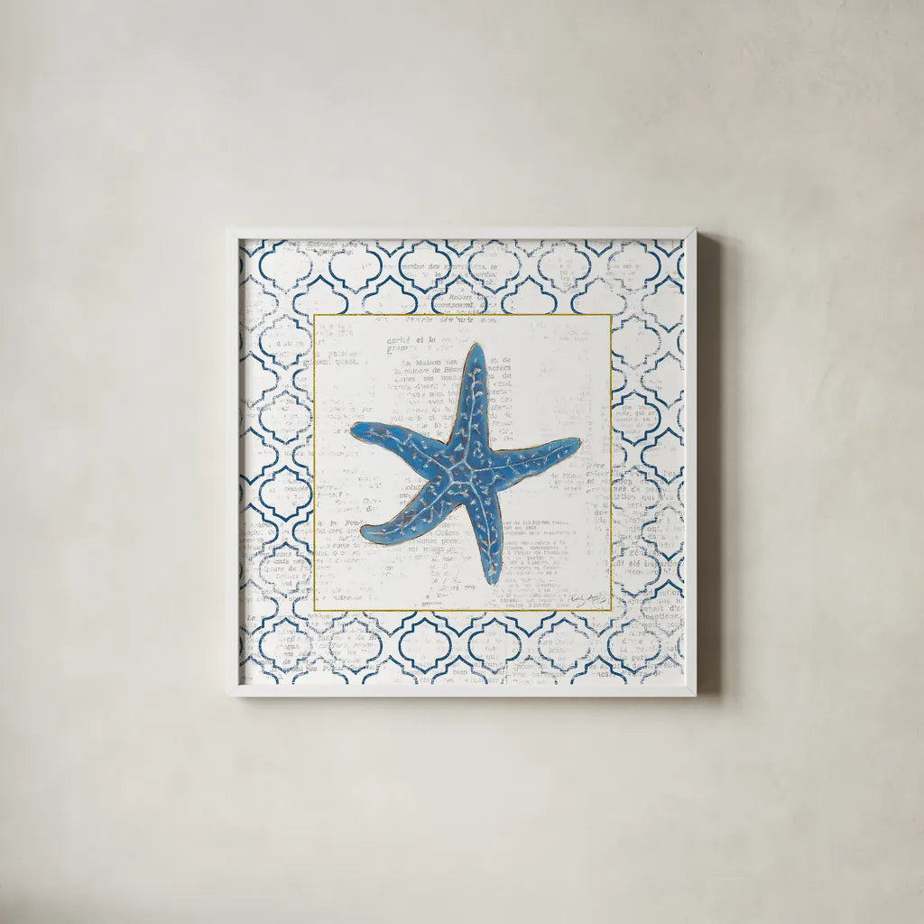 Navy Starfish on Newsprint with Gold by Emily Adams. Shown in a crisp white glass frame for a clean and minimalist style. Available as an archival giclee rolled canvas, fine art paper, or poster print. SKU 23561a.