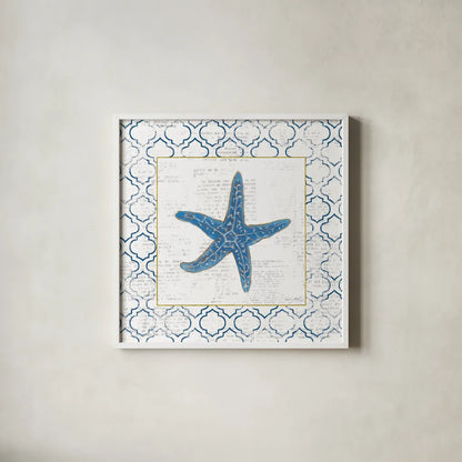 Navy Starfish on Newsprint with Gold by Emily Adams. Shown in a crisp white glass frame for a clean and minimalist style. Available as an archival giclee rolled canvas, fine art paper, or poster print. SKU 23561a.