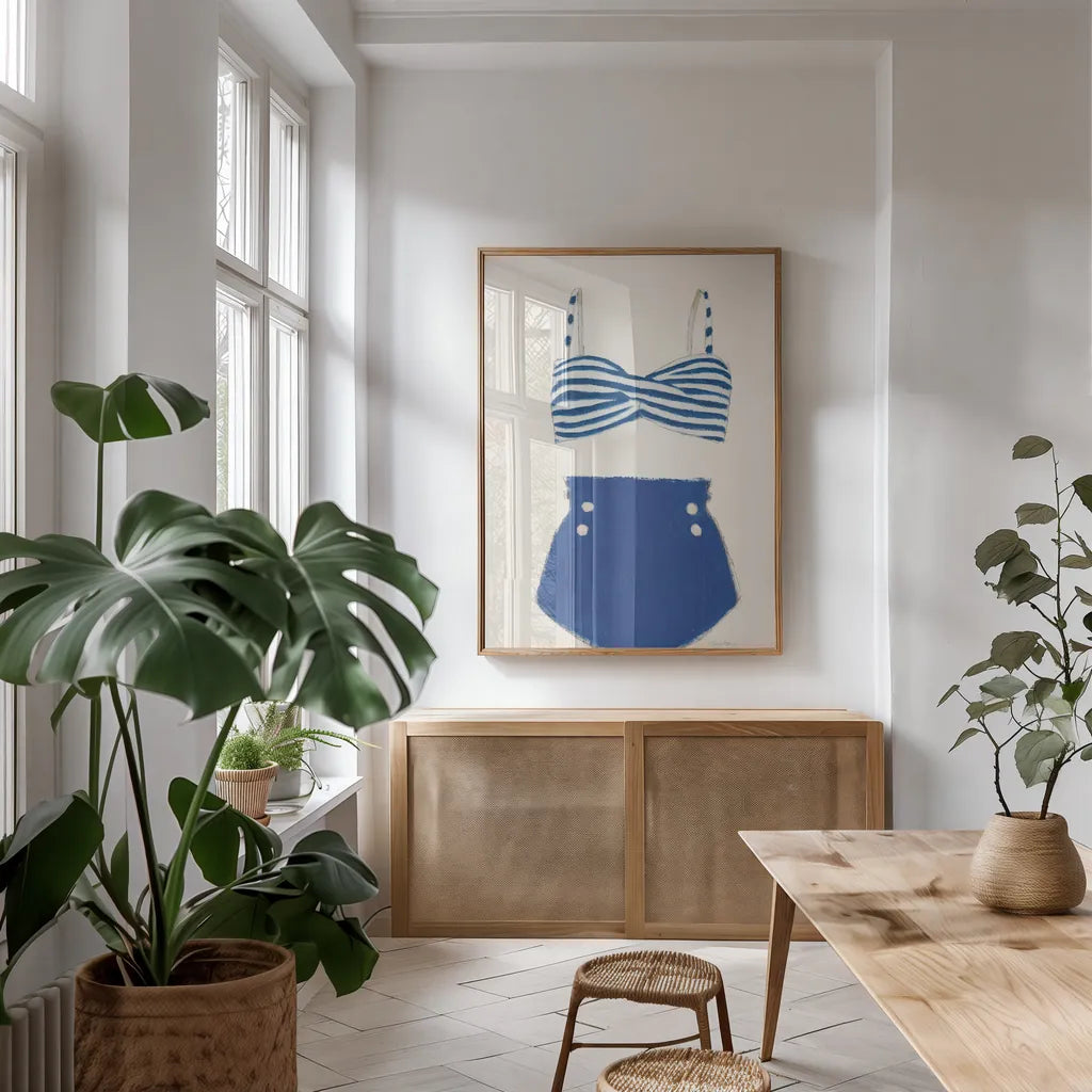 Retro Swimwear II by Emily Adams. shown as a print in a natural wood frame in a dining room. Available as a archival giclee rolled canvas, fine art paper, or poster print. SKU 69132h.