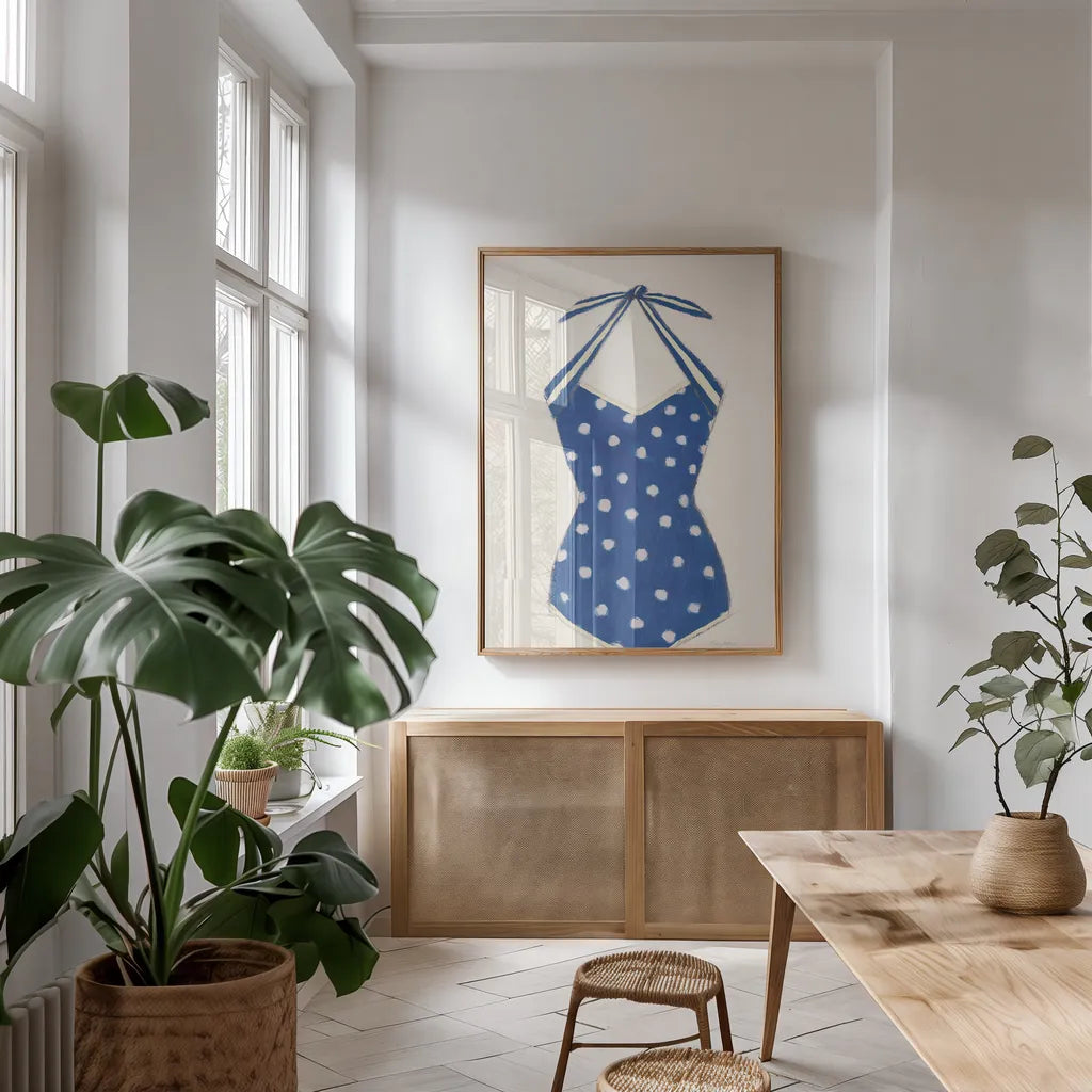 Retro Swimwear II Navy by Emily Adams. shown as a print in a natural wood frame in a dining room. Available as a archival giclee rolled canvas, fine art paper, or poster print. SKU 69131h.