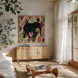 African Animal I Jewel by Farida Zaman. Shown in a natural wood frame in a cozy modern living room. Available as an archival giclee rolled canvas, fine art paper, or poster print. SKU 53984a.