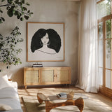 Afro Girl II by Farida Zaman. Shown in a natural wood frame in a cozy modern living room. Available as an archival giclee rolled canvas, fine art paper, or poster print. SKU 68004a.