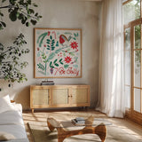 Cheerful Holiday III by Farida Zaman. Shown in a natural wood frame in a cozy modern living room. Available as an archival giclee rolled canvas, fine art paper, or poster print. SKU 54662a.