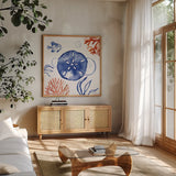 Coastal Jewels IV by Farida Zaman. Shown in a natural wood frame in a cozy modern living room. Available as an archival giclee rolled canvas, fine art paper, or poster print. SKU 35782a.