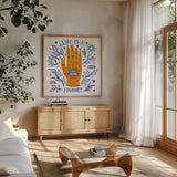 Everyday Mystic II by Farida Zaman. Shown in a natural wood frame in a cozy modern living room. Available as an archival giclee rolled canvas, fine art paper, or poster print. SKU 85725a.