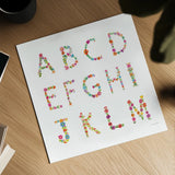 Floral Alphabet Sq I by Farida Zaman. Shown as a detailed flat fine art print, highlighting archival giclee quality. Available as an archival giclee rolled canvas, fine art paper, or poster print. SKU 65967a.
