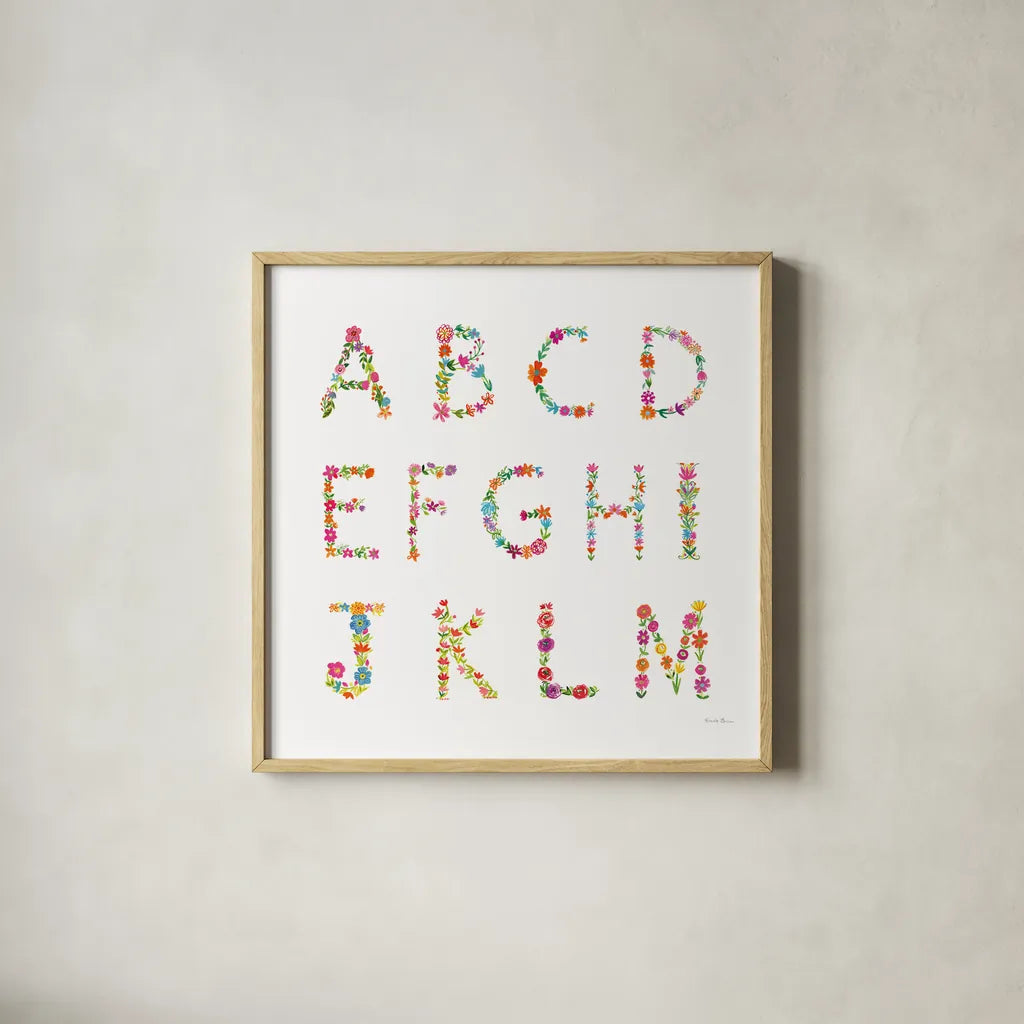 Floral Alphabet Sq I by Farida Zaman. Shown in a natural wood glass frame for a timeless modern aesthetic. Available as an archival giclee rolled canvas, fine art paper, or poster print. SKU 65967a.
