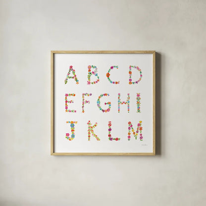 Floral Alphabet Sq I by Farida Zaman. Shown in a natural wood glass frame for a timeless modern aesthetic. Available as an archival giclee rolled canvas, fine art paper, or poster print. SKU 65967a.