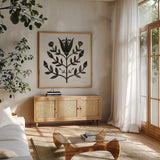 Garden Folk II Black by Farida Zaman. Shown in a natural wood frame in a cozy modern living room. Available as an archival giclee rolled canvas, fine art paper, or poster print. SKU 83251a.