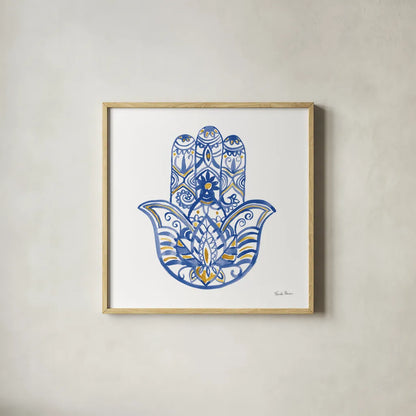 Hamsa I by Farida Zaman. Shown in a natural wood glass frame for a timeless modern aesthetic. Available as an archival giclee rolled canvas, fine art paper, or poster print. SKU 64352a.
