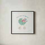 Happy Baby II by Farida Zaman. Shown in a sleek black glass frame for a contemporary gallery look. Available as an archival giclee rolled canvas, fine art paper, or poster print. SKU 49095a.