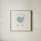 Happy Baby II by Farida Zaman. Shown in a natural wood glass frame for a timeless modern aesthetic. Available as an archival giclee rolled canvas, fine art paper, or poster print. SKU 49095a.