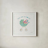 Happy Baby II by Farida Zaman. Shown in a crisp white glass frame for a clean and minimalist style. Available as an archival giclee rolled canvas, fine art paper, or poster print. SKU 49095a.