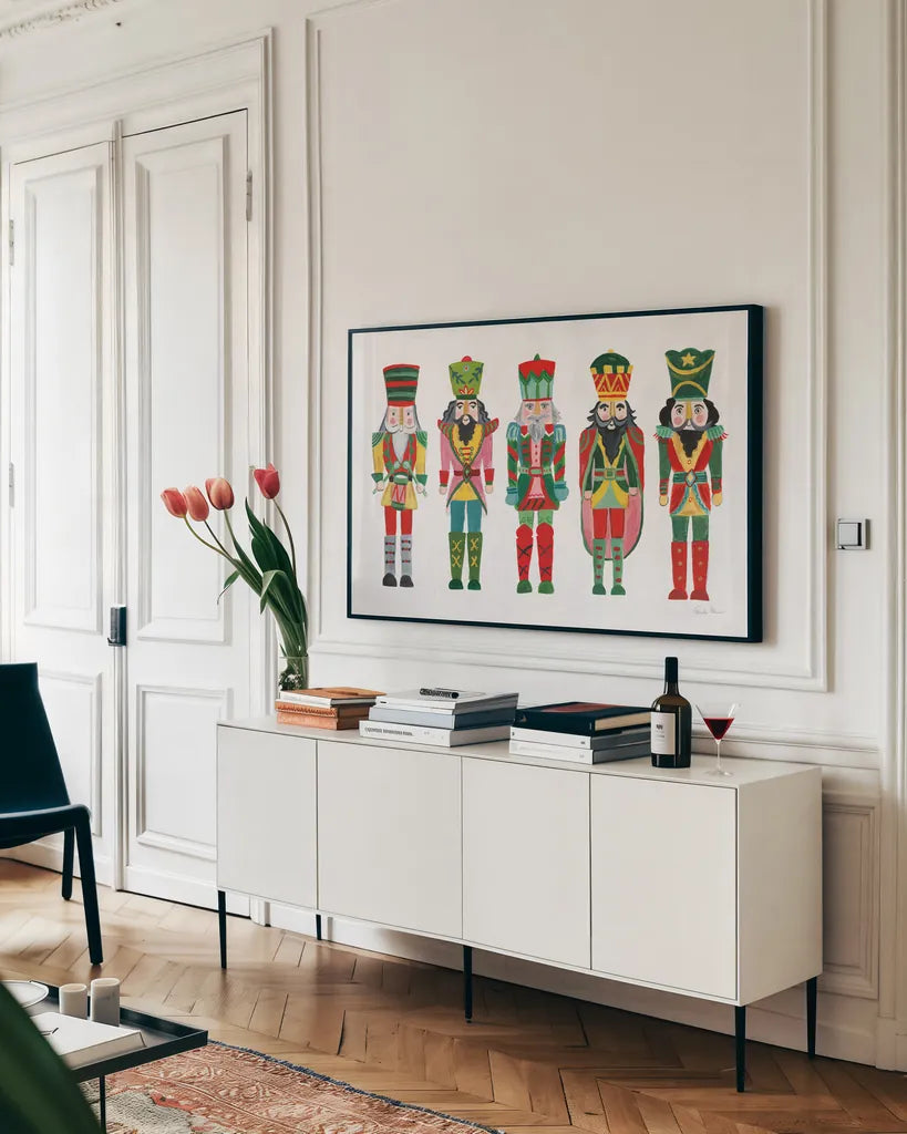 Holiday Nutcrackers I by Farida Zaman. shown as a framed stretched canvas in a living room above a console. Available as a archival giclee rolled canvas, fine art paper, or poster print. SKU 83571i.