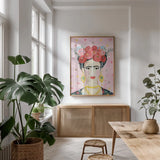 Homage to Frida v2 by Farida Zaman. shown as a print in a natural wood frame in a dining room. Available as a archival giclee rolled canvas, fine art paper, or poster print. SKU 54175h.