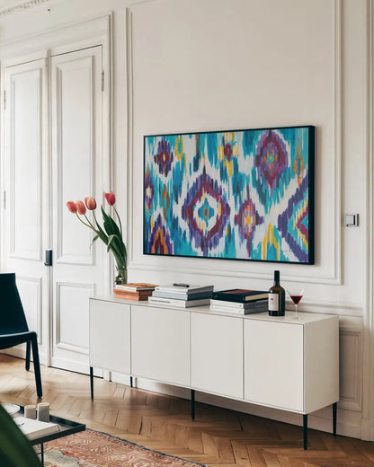 Ikat Jewel I by Farida Zaman. shown as a framed stretched canvas in a living room above a console. Available as a archival giclee rolled canvas, fine art paper, or poster print. SKU 45443i.