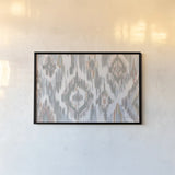 Ikat Jewel I blush grey by Farida Zaman. shown as a paper print in a black flame. Available as a archival giclee rolled canvas, fine art paper, or poster print. SKU 45667i.