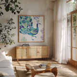 Jewel Peacocks III by Farida Zaman. Shown in a natural wood frame in a cozy modern living room. Available as an archival giclee rolled canvas, fine art paper, or poster print. SKU 41804a.