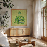 Jeweled Elephant IV by Farida Zaman. Shown in a natural wood frame in a cozy modern living room. Available as an archival giclee rolled canvas, fine art paper, or poster print. SKU 41372a.