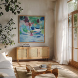 Lake Abstract by Farida Zaman. Shown in a natural wood frame in a cozy modern living room. Available as an archival giclee rolled canvas, fine art paper, or poster print. SKU 60949a.
