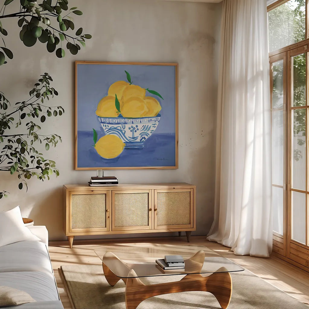 Lemon Still Life by Farida Zaman. Shown in a natural wood frame in a cozy modern living room. Available as an archival giclee rolled canvas, fine art paper, or poster print. SKU 78768a.