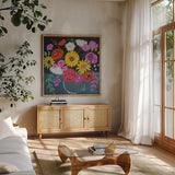 Midnight Floral by Farida Zaman. Shown in a natural wood frame in a cozy modern living room. Available as an archival giclee rolled canvas, fine art paper, or poster print. SKU 38719a.