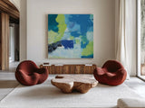 Mountain Reflection II by Farida Zaman. Shown as extra-large giant wall art in a modern living room. Available as an archival giclee rolled canvas, fine art paper, or poster print. SKU 35417a.