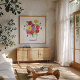Mums by Farida Zaman. Shown in a natural wood frame in a cozy modern living room. Available as an archival giclee rolled canvas, fine art paper, or poster print. SKU 67309a.