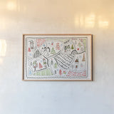 Neighborhood Holiday IV by Farida Zaman. shown as a paper print in a natural frame. Available as a archival giclee rolled canvas, fine art paper, or poster print. SKU 60863i.