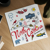 North Carolina by Farida Zaman. Shown as a detailed flat fine art print, highlighting archival giclee quality. Available as an archival giclee rolled canvas, fine art paper, or poster print. SKU 87828a.