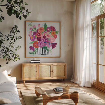 Pink Blossoms II Black Lines by Farida Zaman. Shown in a natural wood frame in a cozy modern living room. Available as an archival giclee rolled canvas, fine art paper, or poster print. SKU 61857a.