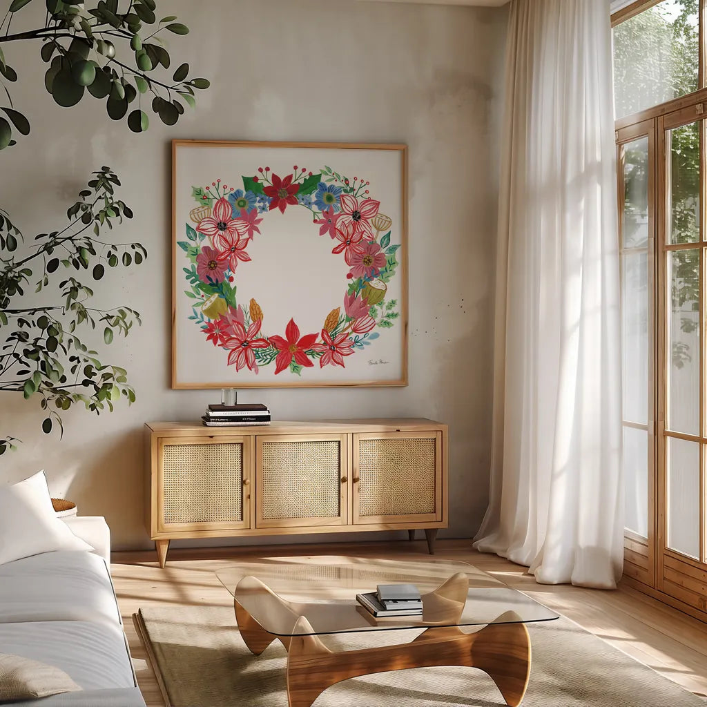 Poinsettia Wreath II by Farida Zaman. Shown in a natural wood frame in a cozy modern living room. Available as an archival giclee rolled canvas, fine art paper, or poster print. SKU 66604a.