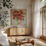 Poppy Burst by Farida Zaman. Shown in a natural wood frame in a cozy modern living room. Available as an archival giclee rolled canvas, fine art paper, or poster print. SKU 38702a.