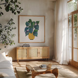 Potted Jewels I by Farida Zaman. Shown in a natural wood frame in a cozy modern living room. Available as an archival giclee rolled canvas, fine art paper, or poster print. SKU 67557a.