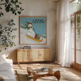 Snowman Snowday II by Farida Zaman. Shown in a natural wood frame in a cozy modern living room. Available as an archival giclee rolled canvas, fine art paper, or poster print. SKU 73377a.