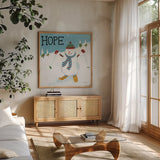 Snowman Snowday V by Farida Zaman. Shown in a natural wood frame in a cozy modern living room. Available as an archival giclee rolled canvas, fine art paper, or poster print. SKU 73380a.