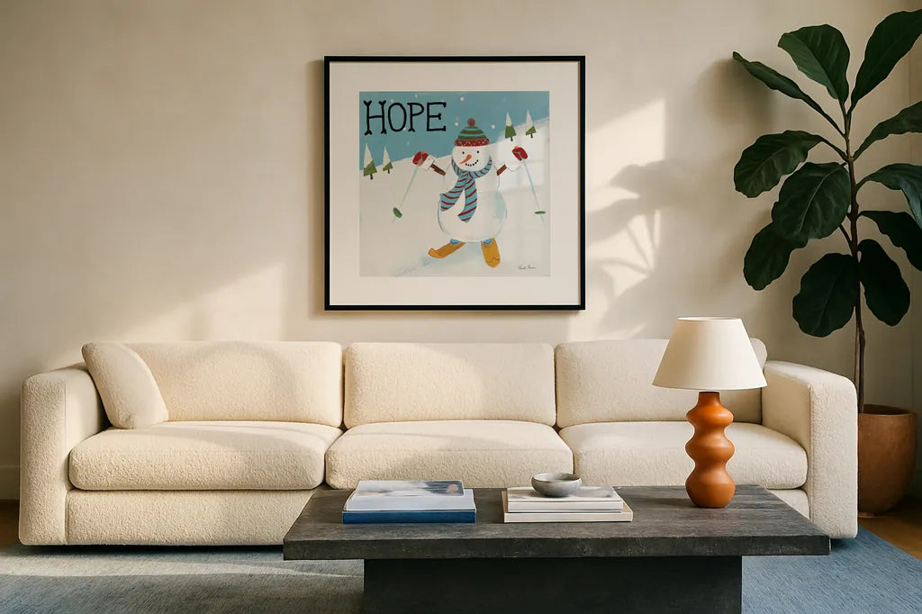 Snowman Snowday V by Farida Zaman. Displayed in a glass frame with matte in a clean modern living room. Available as an archival giclee rolled canvas, fine art paper, or poster print. SKU 73380a.