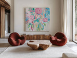 Summer Pink Floral Pastel by Farida Zaman. Shown as extra-large giant wall art in a modern living room. Available as an archival giclee rolled canvas, fine art paper, or poster print. SKU 47392a.