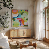 Tango by Farida Zaman. Shown in a natural wood frame in a cozy modern living room. Available as an archival giclee rolled canvas, fine art paper, or poster print. SKU 98750a.