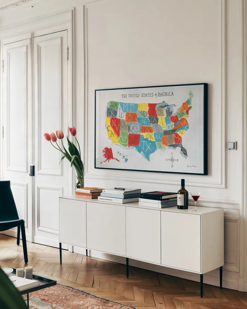 US Map by Farida Zaman. shown as a framed stretched canvas in a living room above a console. Available as a archival giclee rolled canvas, fine art paper, or poster print. SKU 51983i.