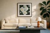 White Roses II by Farida Zaman. Displayed in a glass frame with matte in a clean modern living room. Available as an archival giclee rolled canvas, fine art paper, or poster print. SKU 104322a.