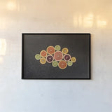 Citrus Drama I by Felicity Bradley. shown as a paper print in a black flame. Available as a archival giclee rolled canvas, fine art paper, or poster print. SKU 45712i.
